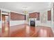 Formal living room with hardwood floors, fireplace, and patterned wallpaper at 101 Greenwich Dr., Georgetown, SC 29440