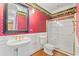 Charming bathroom with a pedestal sink, shower, and gold accents at 101 Greenwich Dr., Georgetown, SC 29440