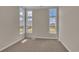 Bright bedroom with neutral walls, carpet flooring, and multiple windows at 1224 Colusa Ct., Little River, SC 29566
