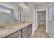 Bathroom boasts double vanity, granite countertop, and walk-in closet at 1224 Colusa Ct., Little River, SC 29566