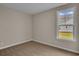 Well-lit bedroom with large window and neutral carpeting at 1224 Colusa Ct., Little River, SC 29566