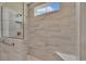 Elegant shower with glass enclosure, built-in seat, and marble tile at 1224 Colusa Ct., Little River, SC 29566