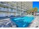 Inviting outdoor pool with ample deck space for lounging at 1012 N Waccamaw Dr. # 111, Garden City Beach, SC 29576