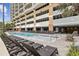 Large outdoor pool with plenty of lounge chairs at 603 S Ocean Blvd. # 1115, North Myrtle Beach, SC 29582