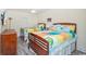 Bedroom with two twin beds, colorful bedding, and wood accents at 603 S Ocean Blvd. # 1115, North Myrtle Beach, SC 29582