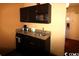 Compact kitchenette with microwave, sink, and mini-fridge at 1501 S Ocean Blvd. # 622, Myrtle Beach, SC 29577