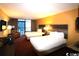 Guest bedroom featuring two double beds, a TV and a small kitchenette at 1501 S Ocean Blvd. # 622, Myrtle Beach, SC 29577