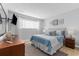 Bright bedroom with a queen-size bed and light blue bedding at 7700 Porcher Dr. # 3207, Myrtle Beach, SC 29572