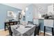 Charming dining area with a square table and light-grey tablecloth at 7700 Porcher Dr. # 3207, Myrtle Beach, SC 29572