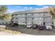 Exterior view of a multi-unit building with ample parking at 7700 Porcher Dr. # 3207, Myrtle Beach, SC 29572