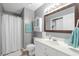 Clean bathroom with a vanity, toilet, shower, and storage cabinet at 7700 Porcher Dr. # 3207, Myrtle Beach, SC 29572