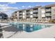 Inviting community swimming pool with plenty of lounge chairs at 7700 Porcher Dr. # 3207, Myrtle Beach, SC 29572