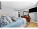 Main bedroom with a king-size bed and dresser, offering a bright and airy feel at 7700 Porcher Dr. # 3207, Myrtle Beach, SC 29572