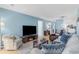 Relaxing living room featuring a large TV and comfortable seating at 7700 Porcher Dr. # 3207, Myrtle Beach, SC 29572