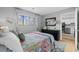 Cozy bedroom with a comfortable bed, dresser, and access to the kitchen at 7700 Porcher Dr. # 3207, Myrtle Beach, SC 29572