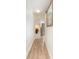 Hallway with wood-look flooring and a decorative flower arrangement at 4800 S Ocean Blvd. # 615, North Myrtle Beach, SC 29582