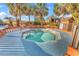 Octagonal hot tub surrounded by a wooden deck and palm trees at 4800 S Ocean Blvd. # 615, North Myrtle Beach, SC 29582