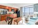 Kitchenette with wood cabinets, black appliances, and a view of the beach at 4800 S Ocean Blvd. # 615, North Myrtle Beach, SC 29582
