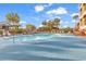 Curved pool with lounge chairs and palm trees at 4800 S Ocean Blvd. # 615, North Myrtle Beach, SC 29582