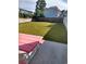 Large backyard with a pink picnic table and plenty of grassy area at 503 30Th Ave. N, Myrtle Beach, SC 29577
