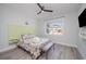 Light and airy bedroom with a unique green headboard and a ceiling fan at 503 30Th Ave. N, Myrtle Beach, SC 29577