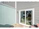 Private back patio with sliding glass doors and small table at 503 30Th Ave. N, Myrtle Beach, SC 29577