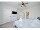 Bright bedroom with a queen bed, TV, and en-suite bathroom access at 503 30Th Ave. N, Myrtle Beach, SC 29577