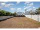 Large backyard with a grassy area and white fence at 503 30Th Ave. N, Myrtle Beach, SC 29577