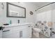 Clean bathroom with white vanity, shower/tub combo, and a patterned shower curtain at 503 30Th Ave. N, Myrtle Beach, SC 29577