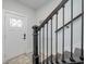 Inviting entryway with a white door and dark wood staircase at 503 30Th Ave. N, Myrtle Beach, SC 29577