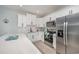 Modern kitchen with white cabinets, stainless steel appliances and breakfast bar at 503 30Th Ave. N, Myrtle Beach, SC 29577