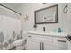 Clean bathroom with white vanity, shower, and patterned shower curtain at 503 30Th Ave. N, Myrtle Beach, SC 29577