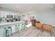 Open concept kitchen with white cabinets, stainless steel appliances, and island at 503 30Th Ave. N, Myrtle Beach, SC 29577