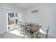 Bright dining area with table and chairs, and sliding glass doors leading to backyard at 503 30Th Ave. N, Myrtle Beach, SC 29577