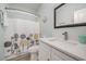 Bathroom with white vanity, shower, and patterned shower curtain at 503 30Th Ave. N, Myrtle Beach, SC 29577