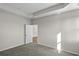 Spacious bedroom with carpet flooring and door to hallway at 3001 Deerberry Place, Longs, SC 29568