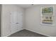 Simple bedroom with neutral walls, carpet, and double doors at 3001 Deerberry Place, Longs, SC 29568