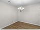 Dining room with hardwood floors and a chandelier at 3001 Deerberry Place, Longs, SC 29568