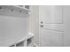 White entryway with built-in bench, cubbies, and coat hooks at 3001 Deerberry Place, Longs, SC 29568