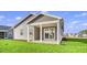 House exterior featuring a covered porch and well-manicured lawn at 3001 Deerberry Place, Longs, SC 29568