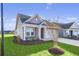 House exterior showcasing gray siding, landscaping, and driveway at 3001 Deerberry Place, Longs, SC 29568