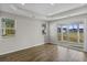 Living room with hardwood floors, sliding glass door to patio, and neutral walls at 3001 Deerberry Place, Longs, SC 29568