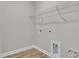 Laundry room with wire shelving and vinyl flooring at 1216 Colusa Ct., Little River, SC 29566