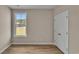 Bright bedroom with double doors and large window at 1216 Colusa Ct., Little River, SC 29566