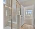 Bathroom with a walk-in shower and a view into a bedroom at 1216 Colusa Ct., Little River, SC 29566