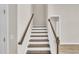 Elegant staircase with dark wood steps and white risers at 1216 Colusa Ct., Little River, SC 29566