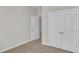 Bedroom with carpet, double doors and an additional door at 1216 Colusa Ct., Little River, SC 29566