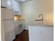 White kitchen with granite countertops and appliances at 178 Salt Marsh Circle # 30F, Pawleys Island, SC 29585