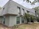 Two-story building with gray siding and a gray shingle roof at 178 Salt Marsh Circle # 30F, Pawleys Island, SC 29585