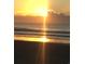 Sunrise over the beach with calm ocean waves at 2711 S Ocean Blvd. S # 1421, North Myrtle Beach, SC 29582